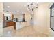 Open dining area adjacent to the kitchen, featuring a chandelier and tile floors at 10829 N 11Th Pl, Phoenix, AZ 85020
