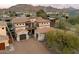Stunning home with a tile roof, multiple garages, and an inviting entryway showcasing architectural charm at 10829 N 11Th Pl, Phoenix, AZ 85020