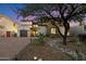 View of an elegant stucco home with stone accents, mature landscaping, and a brick driveway at 10829 N 11Th Pl, Phoenix, AZ 85020