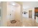 Bright foyer with decorative tile and neutral walls leading to the dining and kitchen areas at 10829 N 11Th Pl, Phoenix, AZ 85020