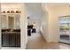 Hallway leading to bedroom featuring stylish bathroom with dual sinks at 10829 N 11Th Pl, Phoenix, AZ 85020