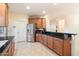 Spacious kitchen featuring wooden cabinets, stainless steel appliances, and granite countertops at 10829 N 11Th Pl, Phoenix, AZ 85020