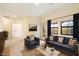 Bright living room with neutral walls, modern furnishings, and natural light from the windows with mountain views at 10829 N 11Th Pl, Phoenix, AZ 85020