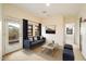 Comfortable living room featuring neutral walls, modern furnishings, and access to the balcony at 10829 N 11Th Pl, Phoenix, AZ 85020