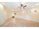 Living room with ceiling fans and stairs leading to the second floor at 10829 N 11Th Pl, Phoenix, AZ 85020