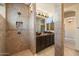 Bathroom shower showcasing tiled walls, mosaic accents, and a modern shower head fixture at 10829 N 11Th Pl, Phoenix, AZ 85020