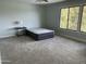 Simple bedroom with a ceiling fan, nice carpet, and a view out the window at 11407 N Pinto Dr, Fountain Hills, AZ 85268