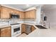 Well-lit kitchen featuring modern appliances and beautiful countertops at 14003 W Cavalcade Dr, Sun City West, AZ 85375