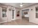 Cozy sun room with tile floors and lots of natural light, open to kitchen and dining areas at 14003 W Cavalcade Dr, Sun City West, AZ 85375