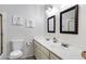 Bathroom featuring a double vanity sink with a decorative mirror and art at 1530 E Alameda Dr, Tempe, AZ 85282