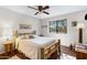 Bedroom with wood floors, a ceiling fan, and a natural wood bed frame at 1530 E Alameda Dr, Tempe, AZ 85282