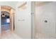 Bathroom with a tiled shower featuring white marble-style tile and tiled floors at 1737 E Azalea Dr, Gilbert, AZ 85298