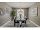 Dining room features a modern chandelier, gray walls, and seating for six at 1737 E Azalea Dr, Gilbert, AZ 85298