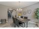 Cozy dining room features a modern chandelier, gray walls, seating for six at 1737 E Azalea Dr, Gilbert, AZ 85298