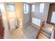 Bright foyer featuring hardwood flooring, multiple windows and a staircase at 1737 E Azalea Dr, Gilbert, AZ 85298
