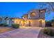Spacious home exterior featuring a wide driveway and meticulously landscaped front yard at 1737 E Azalea Dr, Gilbert, AZ 85298