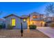 Charming two-story home with a well-manicured front yard and attached two-car garage at 1737 E Azalea Dr, Gilbert, AZ 85298