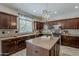 Well-equipped kitchen boasts stainless appliances, ample counter space and mosaic backsplash at 1737 E Azalea Dr, Gilbert, AZ 85298