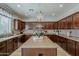 Stunning kitchen with stainless appliances, an island and attractive chandelier at 1737 E Azalea Dr, Gilbert, AZ 85298