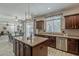 Beautiful kitchen with island, dining area and seamless flow to the outside patio at 1737 E Azalea Dr, Gilbert, AZ 85298