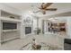 Spacious living room features a fireplace, open layout to dining area and backyard at 1737 E Azalea Dr, Gilbert, AZ 85298