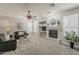 Comfortable living room featuring plush seating, fireplace, and ample natural light at 1737 E Azalea Dr, Gilbert, AZ 85298