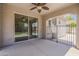 Covered patio with ceiling fan and sliding glass doors leading to the house at 1737 E Azalea Dr, Gilbert, AZ 85298