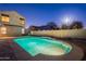 Enjoy this sparkling pool with waterfall feature and easy access from the covered patio at 1737 E Azalea Dr, Gilbert, AZ 85298