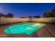 Sparkling pool with Baja step provides a relaxing backyard oasis in the evening light at 1737 E Azalea Dr, Gilbert, AZ 85298