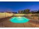 This refreshing pool features a calming waterfall and secure perimeter fencing at 1737 E Azalea Dr, Gilbert, AZ 85298