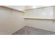 Bright walk-in closet offering ample storage space with rods and shelves at 1737 E Azalea Dr, Gilbert, AZ 85298