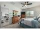 Spacious bedroom featuring a large closet, neutral carpet and view to the living area at 18644 N Desert Willow Dr, Maricopa, AZ 85138