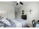 Comfortable bedroom featuring a ceiling fan, a window, and closet space at 18644 N Desert Willow Dr, Maricopa, AZ 85138