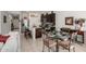 Dining area featuring a glass-top table and a breakfast bar, ideal for casual dining experiences at 18644 N Desert Willow Dr, Maricopa, AZ 85138