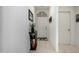 Neutral entryway featuring stylish decor, neutral paint, and tile flooring at 18644 N Desert Willow Dr, Maricopa, AZ 85138