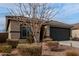 Charming single-story home with a well-maintained yard and two car garage at 18644 N Desert Willow Dr, Maricopa, AZ 85138