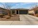 Inviting single-story home with a spacious driveway and low-maintenance landscaping at 18644 N Desert Willow Dr, Maricopa, AZ 85138