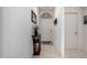 Inviting hallway with decoratively embellished front door, complementing the home's aesthetic appeal at 18644 N Desert Willow Dr, Maricopa, AZ 85138