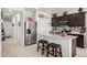 Bright kitchen features stainless steel appliances, speckled granite countertops, and tiled floors at 18644 N Desert Willow Dr, Maricopa, AZ 85138