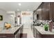 Spacious kitchen with stainless steel appliances, granite counters, and ample cabinet space at 18644 N Desert Willow Dr, Maricopa, AZ 85138