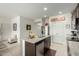 Open kitchen concept with island, granite countertops, and modern appliances at 18644 N Desert Willow Dr, Maricopa, AZ 85138