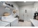 A well-organized laundry room with a washer, dryer, and ample storage space at 18644 N Desert Willow Dr, Maricopa, AZ 85138