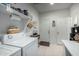 Spacious laundry room featuring a washer, dryer, and utility sink at 18644 N Desert Willow Dr, Maricopa, AZ 85138