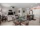 Open-concept living room showcases a dining area and a spacious seating arrangement, perfect for relaxation at 18644 N Desert Willow Dr, Maricopa, AZ 85138