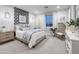 Stylish bedroom with a patterned accent wall, comfortable bed, and a surfboard as decor, creating a coastal vibe at 19201 W Missouri Ave, Litchfield Park, AZ 85340