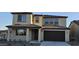Two-story home featuring a neutral-toned exterior, covered entry, and two-car garage at 19201 W Missouri Ave, Litchfield Park, AZ 85340