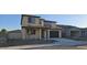 Two-story home with neutral colors, a 2-car garage, and minimal desert landscaping at 19201 W Missouri Ave, Litchfield Park, AZ 85340