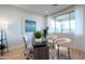 Well-lit home office featuring a modern desk, chairs, and a calming view outside at 19201 W Missouri Ave, Litchfield Park, AZ 85340