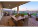 Spacious outdoor patio with dining and seating furniture for outdoor entertaining at 19201 W Missouri Ave, Litchfield Park, AZ 85340