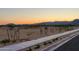 Street view highlighting the community's landscape, streetlights and mountain views at 19201 W Missouri Ave, Litchfield Park, AZ 85340